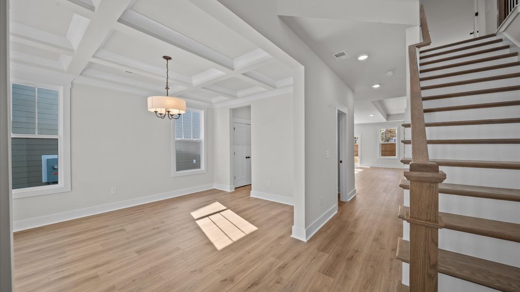 Vibrant entry highlighted by hardwood floors and accomplished design choices Vibrant entry highlighted by hardwood floors and accomplished design choices