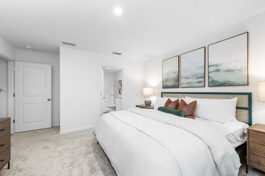 A bedroom with a bed and a lamp. A bedroom with a bed and a lamp.