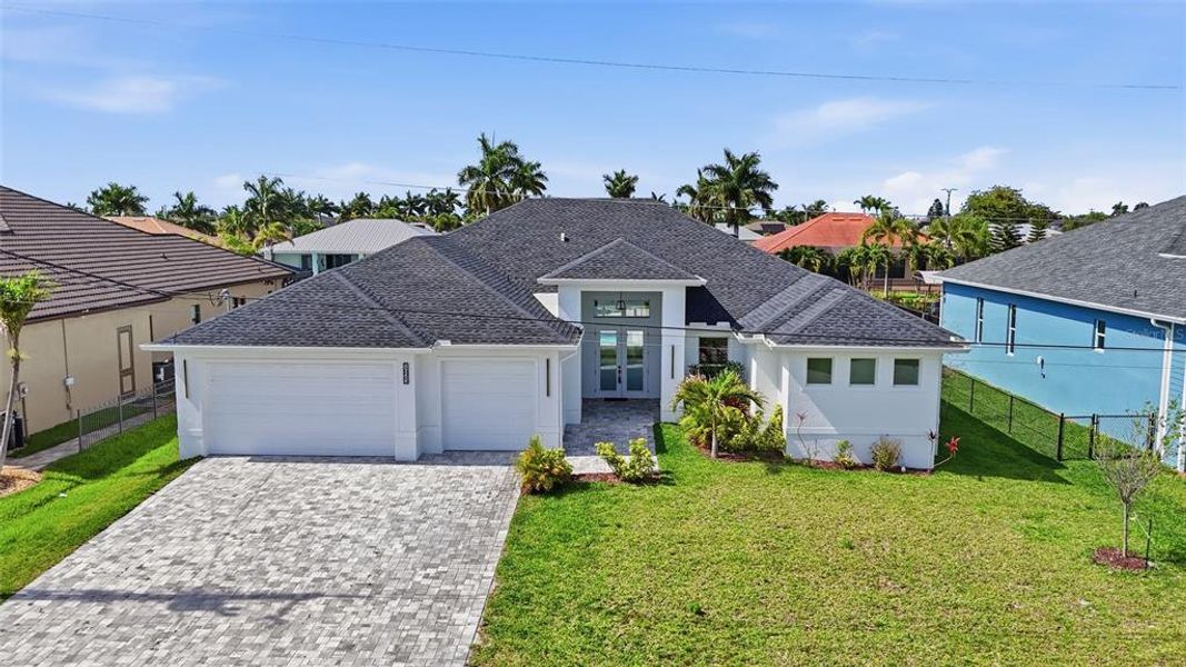 Front exterior of a new home in , Cape Coral, FL, highlighting curb appeal (Image 24).