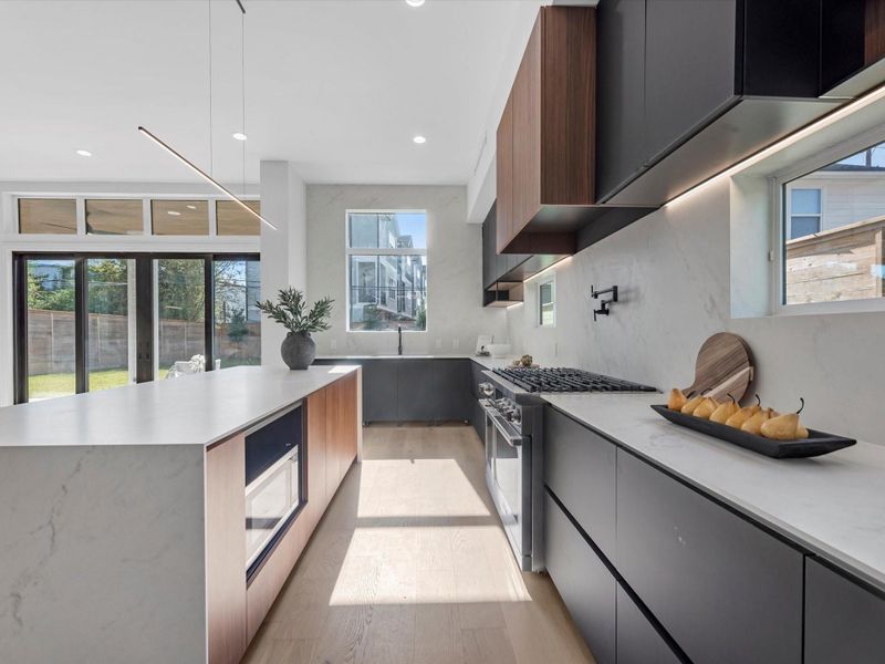 The home is bathed in natural light due to oversized windows throughout the home.