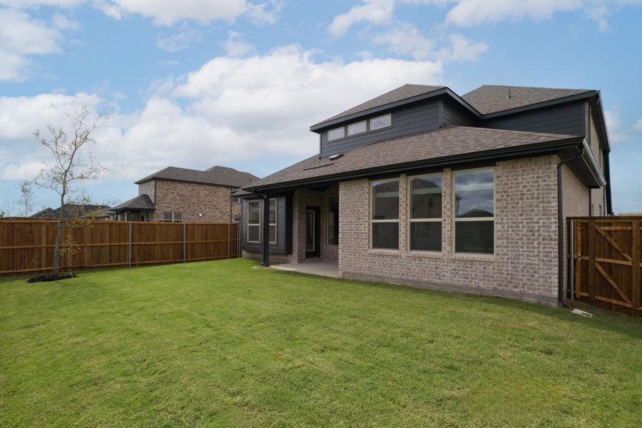 Exterior details and patio area of a home in Whitewing Trails, Princeton (Image 2).