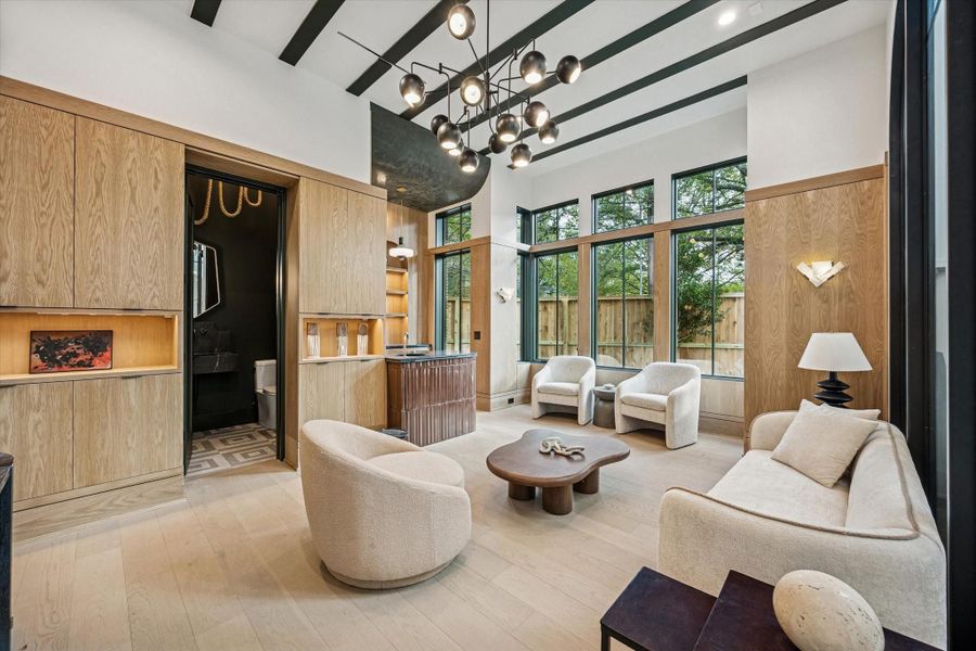 Downstairs gameroom with wetbar and half bath.