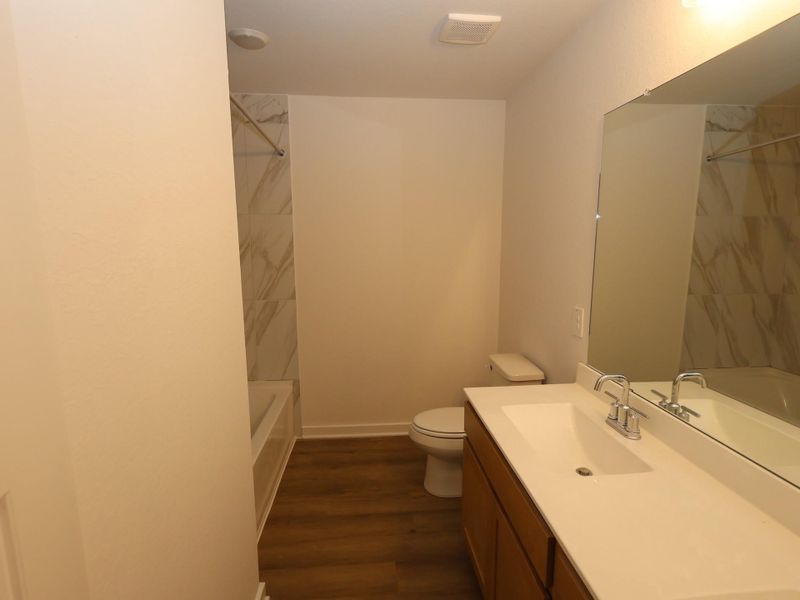 Furnished interior view inside a new home in Pinewood at Grand Texas, New Caney (Image 9).