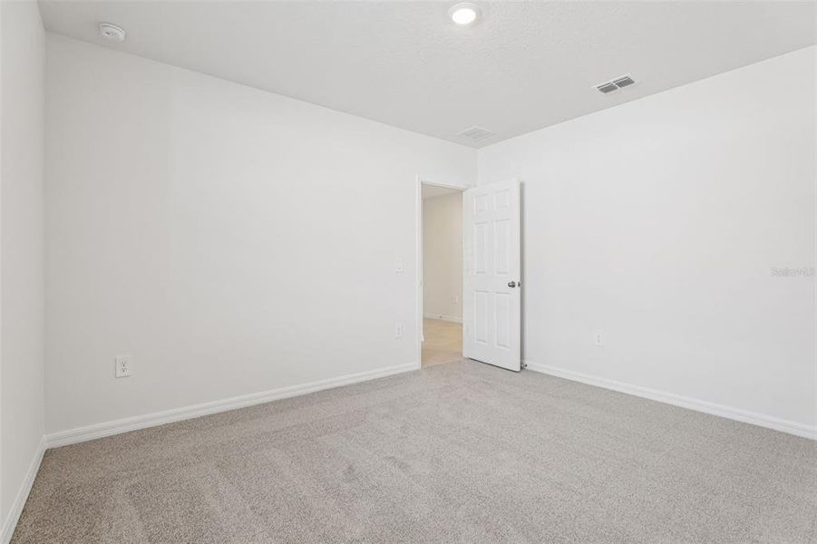 Spacious, unfurnished interior of a new home in Lake Deer Estates - Signature Series, Poinciana (Image 20).