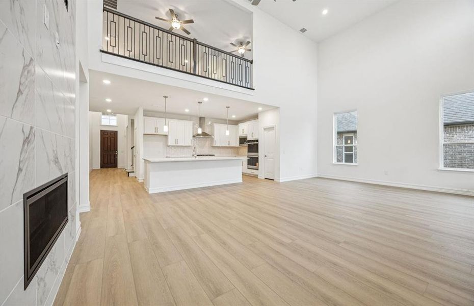 Gathering room with view of main living areas *Model Representation*