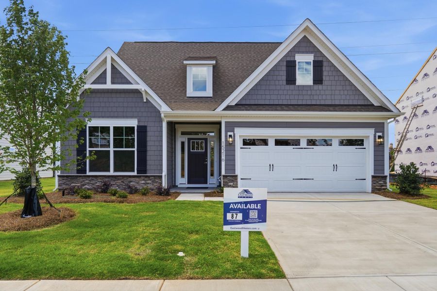 Front exterior of a new home in Enclave at Riverdale, Huntersville, NC, highlighting curb appeal (Image 1). Front exterior of a new home in Enclave at Riverdale, Huntersville, NC, highlighting curb appeal (Image 1).