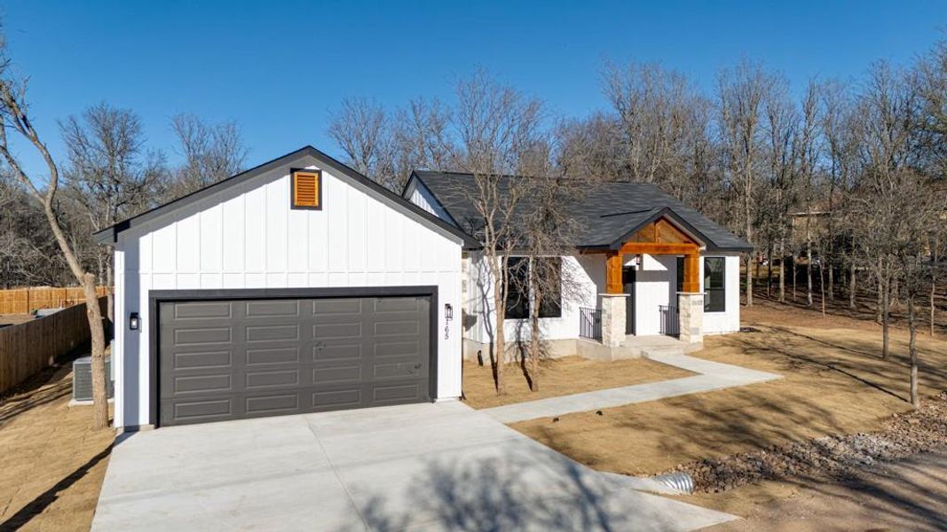 Front exterior of a new home in , Bastrop, TX, highlighting curb appeal (Image 19).