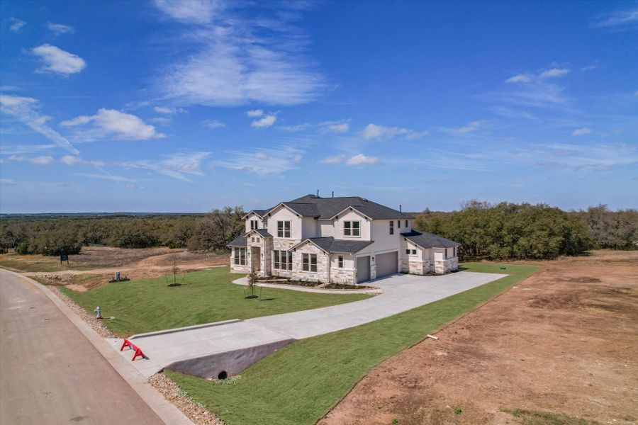 Representative exterior photo of a completed home built from the Boerne by Giddens Homes in Whispering Wind, Bertram, TX (Image 33). Representative exterior photo of a completed home built from the Boerne by Giddens Homes in Whispering Wind, Bertram, TX (Image 33).