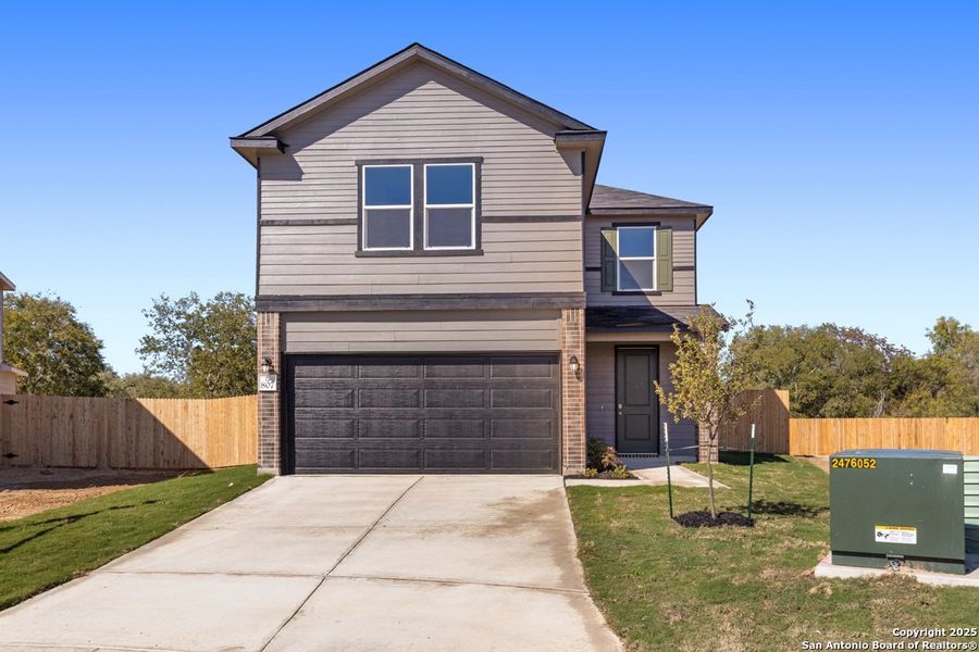 Front exterior of a new home in The Granary - Heritage Collection, San Antonio, TX, highlighting curb appeal (Image 1). Front exterior of a new home in The Granary - Heritage Collection, San Antonio, TX, highlighting curb appeal (Image 1).