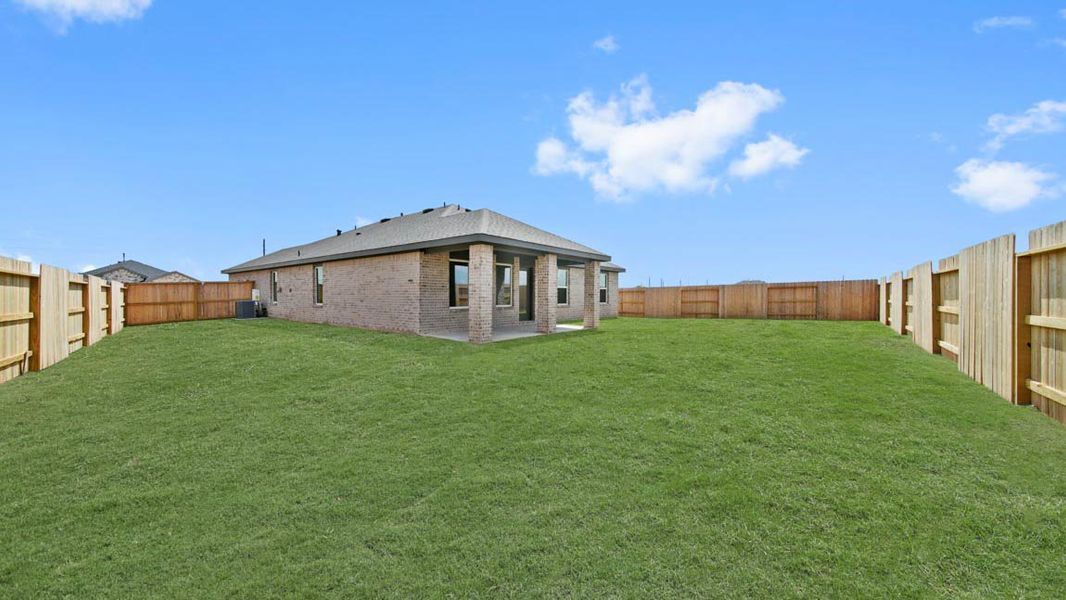 Exterior details and patio area of a home in Sunterra Lakes, Brookshire (Image 3).