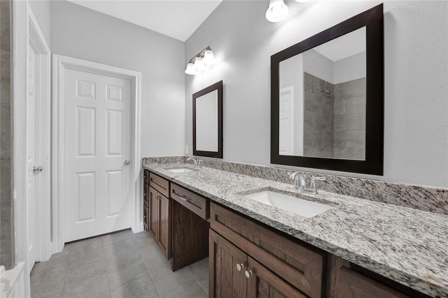 Double sinks plus a vanity! No need for sharing in here!