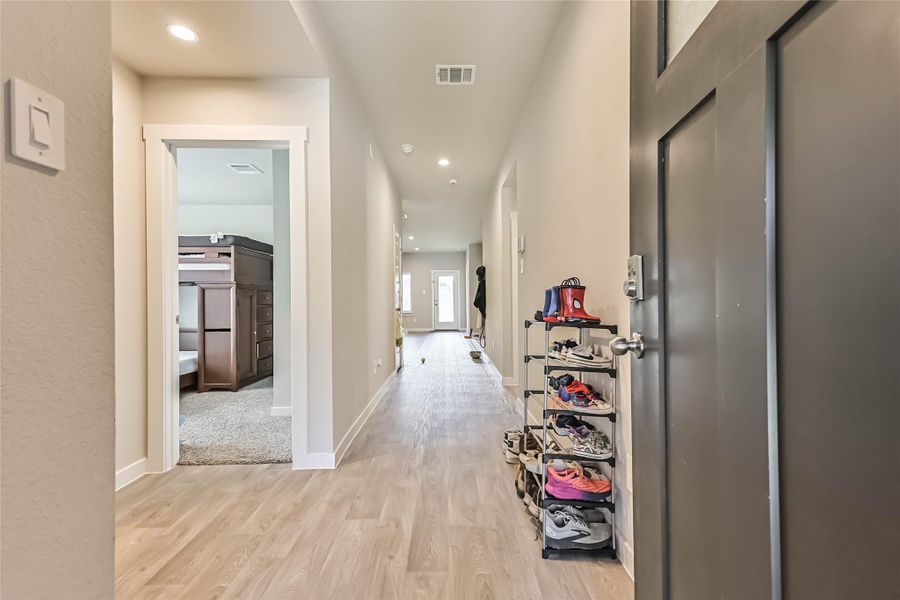 Welcoming foyer with upgraded flooring and open sightlines to the main living areas.