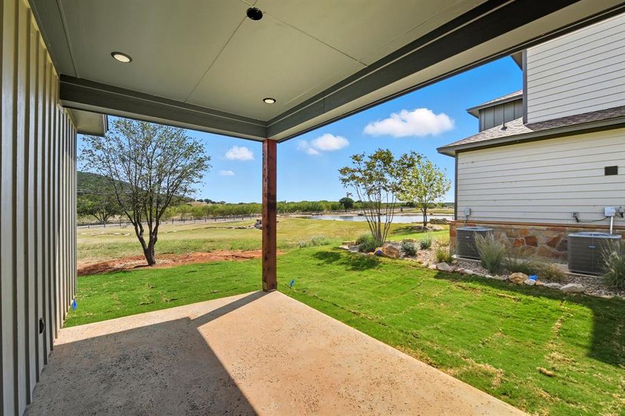 View of patio / terrace featuring a water view View of patio / terrace featuring a water view