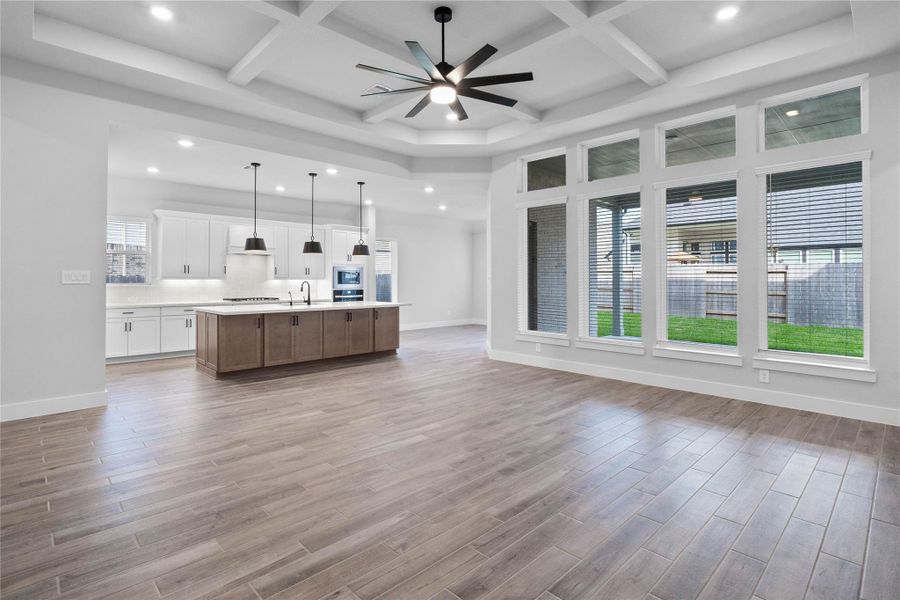 Stunning open-concept design seamlessly connecting the living, dining, and kitchen areas—perfect for both everyday living and entertaining!