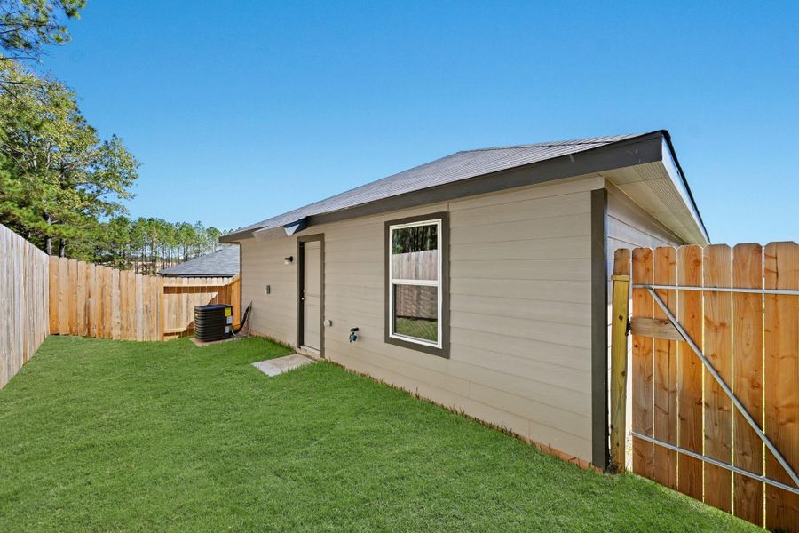 Exterior details and patio area of a home in , Conroe (Image 3).