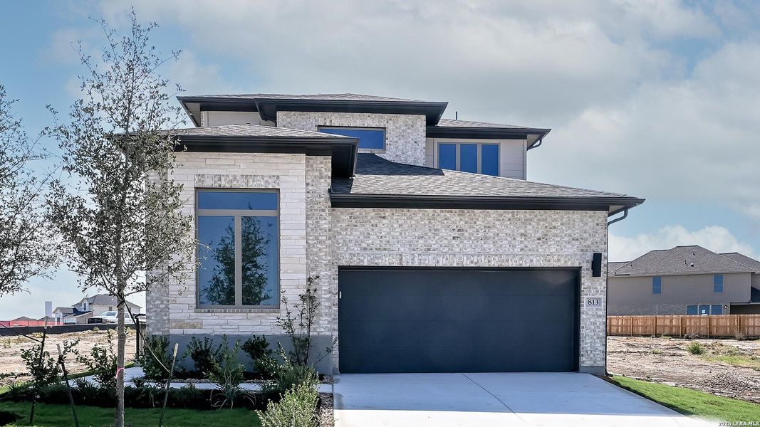Front exterior of a new home in Legacy at Lake Dunlap, New Braunfels, TX, highlighting curb appeal (Image 21).