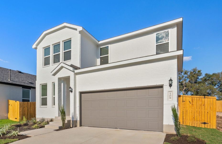 Front exterior of a new home in Woodside, Georgetown, TX, highlighting curb appeal (Image 22).