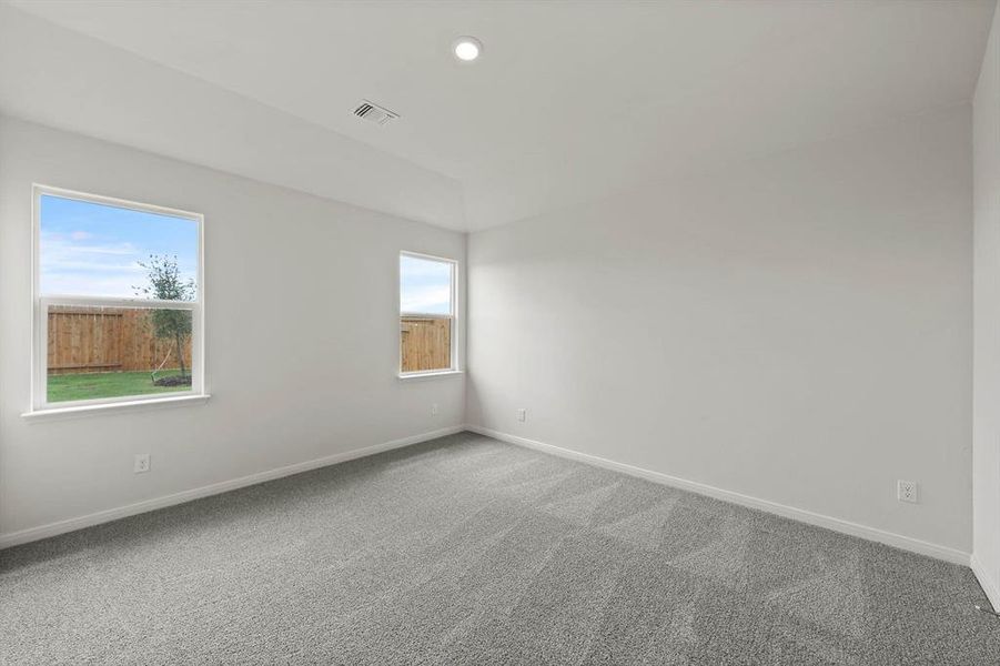 Spare room featuring carpet floors and recessed lighting Spare room featuring carpet floors and recessed lighting