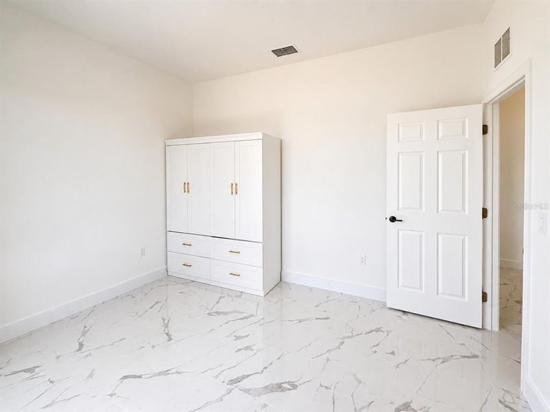 Spacious, unfurnished interior of a new home in , Cape Coral (Image 19). Spacious, unfurnished interior of a new home in , Cape Coral (Image 19).