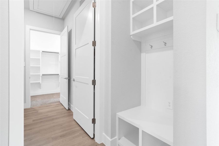 The ultimate in organization and cleanliness—a dedicated mudroom designed to manage daily life with ease. This highly desirable space serves as the perfect "drop zone" between the outdoors and your main living areas, helping to keep your home tidy and clutter-free.