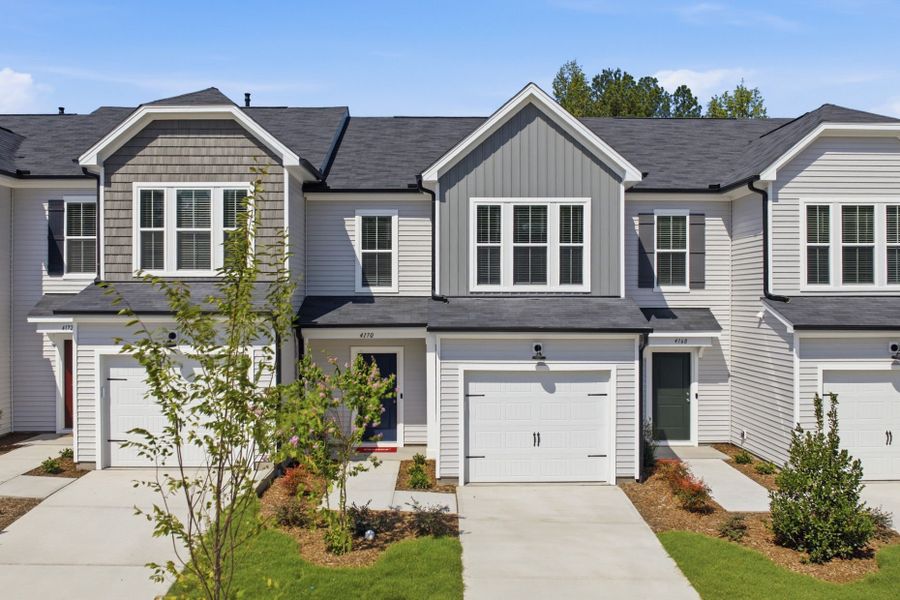 Front exterior of a new home in Carpenter Falls, Durham, NC, highlighting curb appeal (Image 28). Front exterior of a new home in Carpenter Falls, Durham, NC, highlighting curb appeal (Image 28).