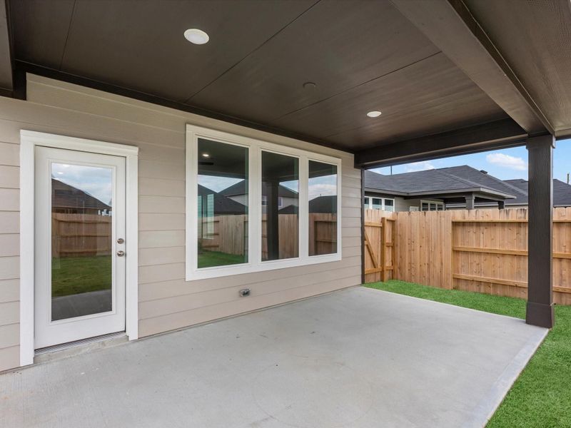 Exterior details and patio area of a home in Mason Woods, Cypress (Image 3).