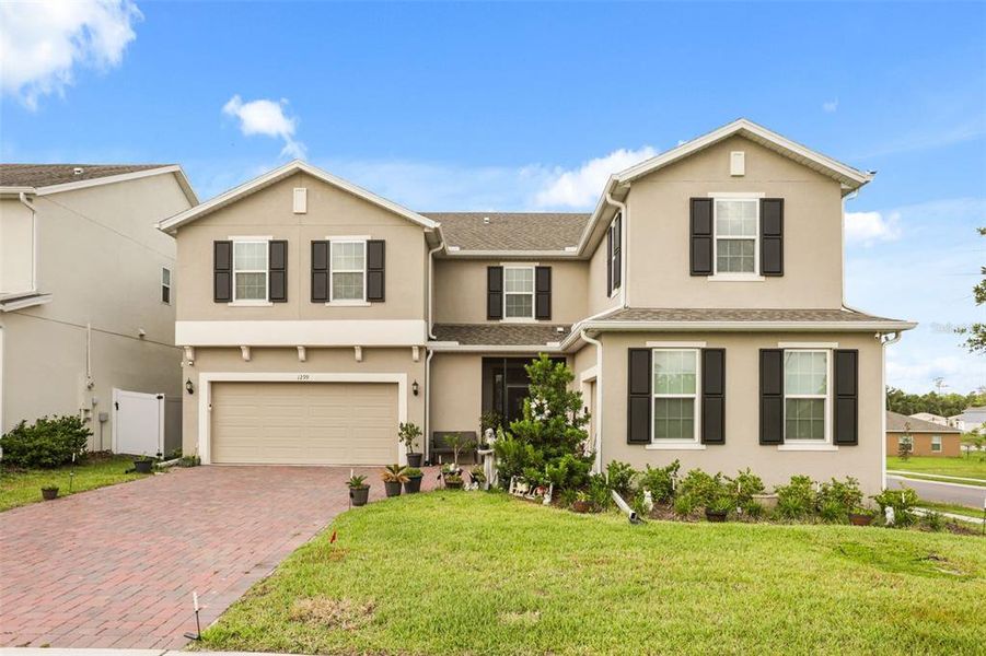 Front exterior of a new home in Beresford Woods, Deland, FL, highlighting curb appeal (Image 20). Front exterior of a new home in Beresford Woods, Deland, FL, highlighting curb appeal (Image 20).