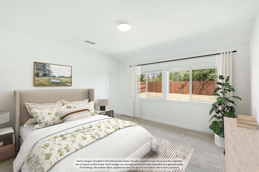 Bedroom with upholstered bed, carpet flooring, and large window with backyard view