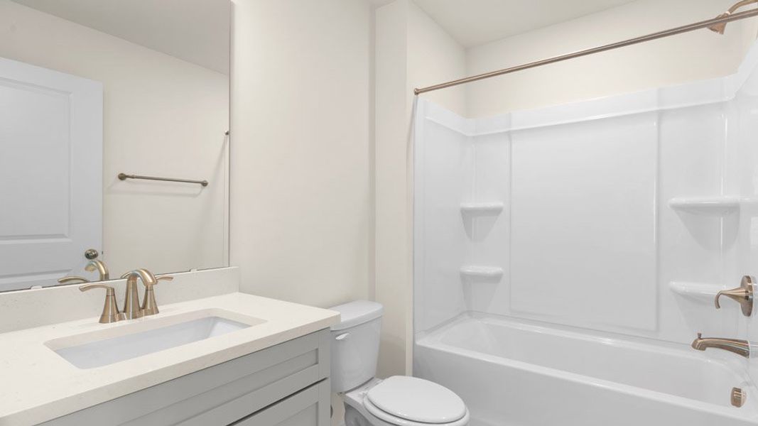 Furnished interior view inside a new home in Lybrook Village, Advance (Image 9).