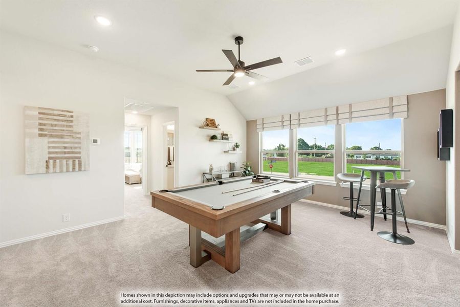 Game room with pool table, vaulted ceiling, ceiling fan, and large windows overlooking backyard