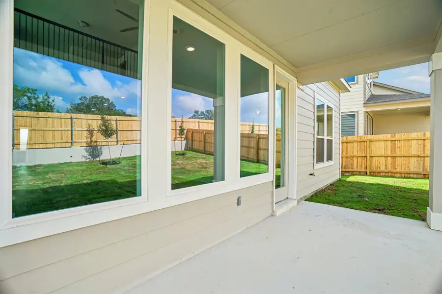 Exterior details and patio area of a home in The Meadows at Hunters Ranch, San Antonio (Image 4).