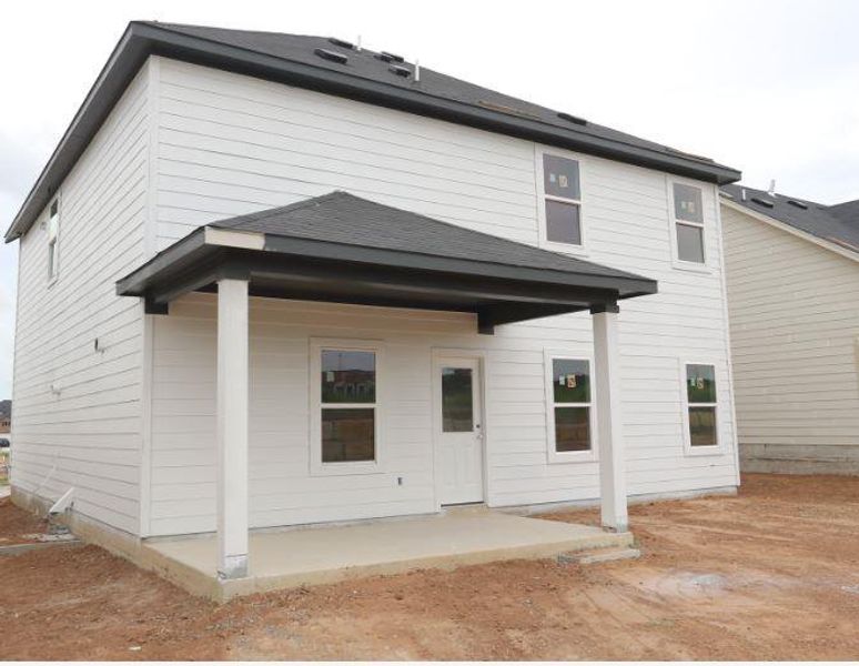 Front exterior of a new home in Cascades at Onion Creek, Austin, TX, highlighting curb appeal (Image 1). Front exterior of a new home in Cascades at Onion Creek, Austin, TX, highlighting curb appeal (Image 1).