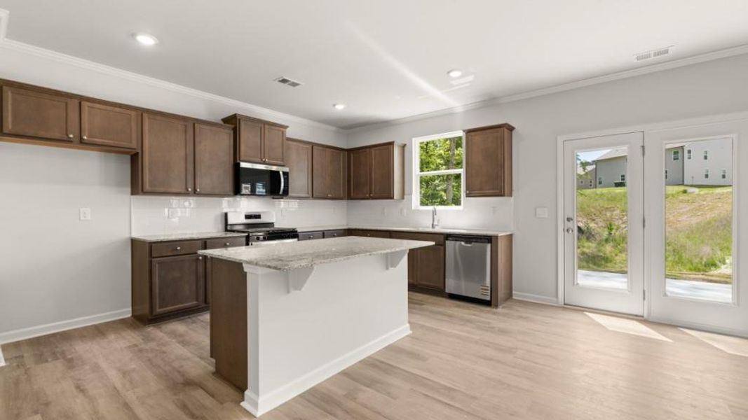 Furnished interior view inside a new home in Northwoods at Mirror Lake, Villa Rica (Image 8).
