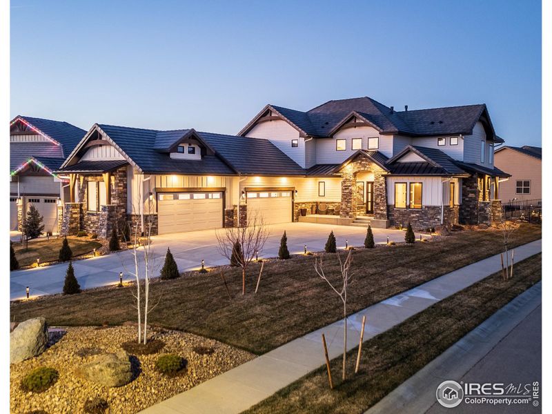 Front exterior of a new home in , Berthoud, CO, highlighting curb appeal (Image 1).