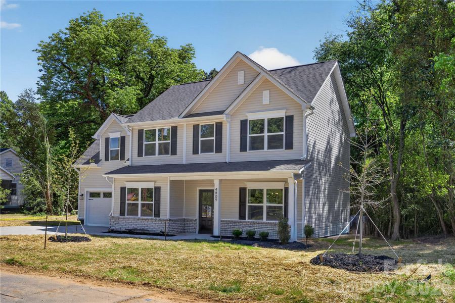 Front exterior of a new home in , Charlotte, NC, highlighting curb appeal (Image 2). Front exterior of a new home in , Charlotte, NC, highlighting curb appeal (Image 2).