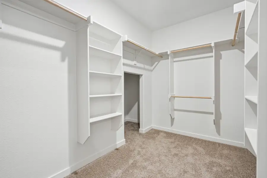 Walk In Closet in the Wimbledon home plan by Trophy Signature Homes