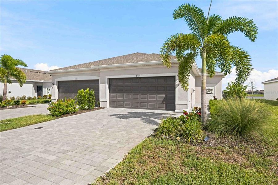 Front exterior of a new home in , Englewood, FL, highlighting curb appeal (Image 27). Front exterior of a new home in , Englewood, FL, highlighting curb appeal (Image 27).