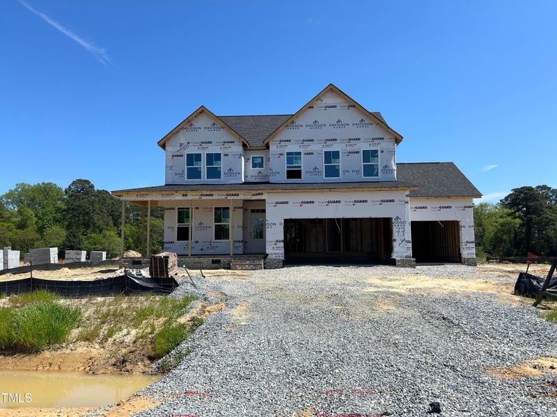 Front exterior of a new home in Tobacco Road, Angier, NC, highlighting curb appeal (Image 59). Front exterior of a new home in Tobacco Road, Angier, NC, highlighting curb appeal (Image 59).