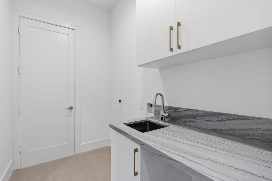 Utility room opens from primary closet and hall.