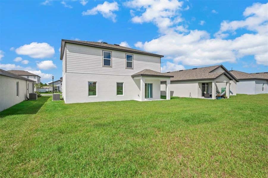 Exterior details and patio area of a home in Peach Crossings, Winter Haven (Image 4).