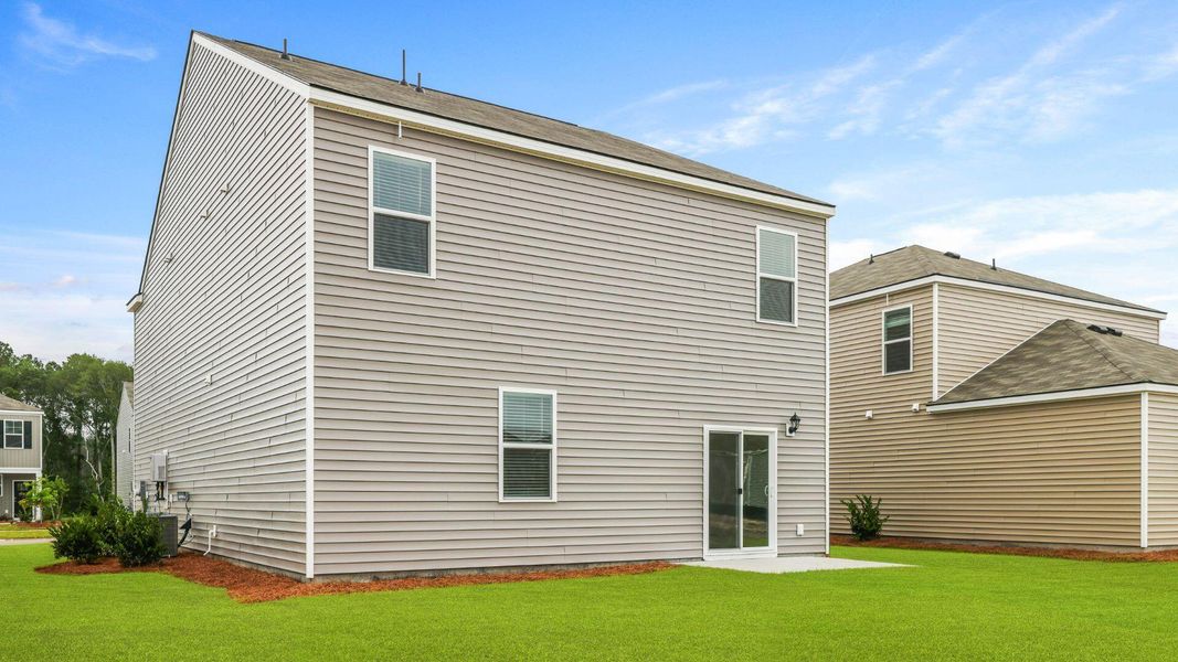 Exterior details and patio area of a home in Pine Hills at Cane Bay, Moncks Corner (Image 2).