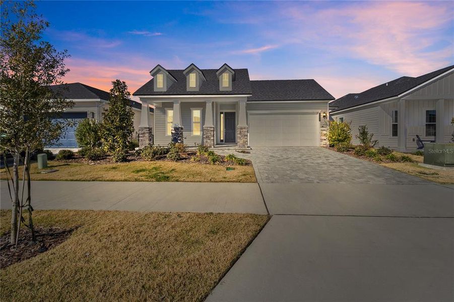 Front exterior of a new home in Oakmont, Gainesville, FL, highlighting curb appeal (Image 2). Front exterior of a new home in Oakmont, Gainesville, FL, highlighting curb appeal (Image 2).