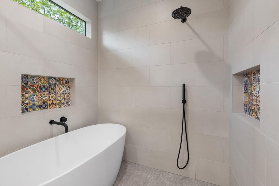 Thoughtful design gives the primary bathroom an elevated, retreat-like atmosphere. Thoughtful design gives the primary bathroom an elevated, retreat-like atmosphere.