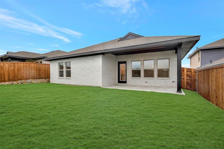 Exterior details and patio area of a home in Aspire at Noble Ridge, Howe (Image 1).