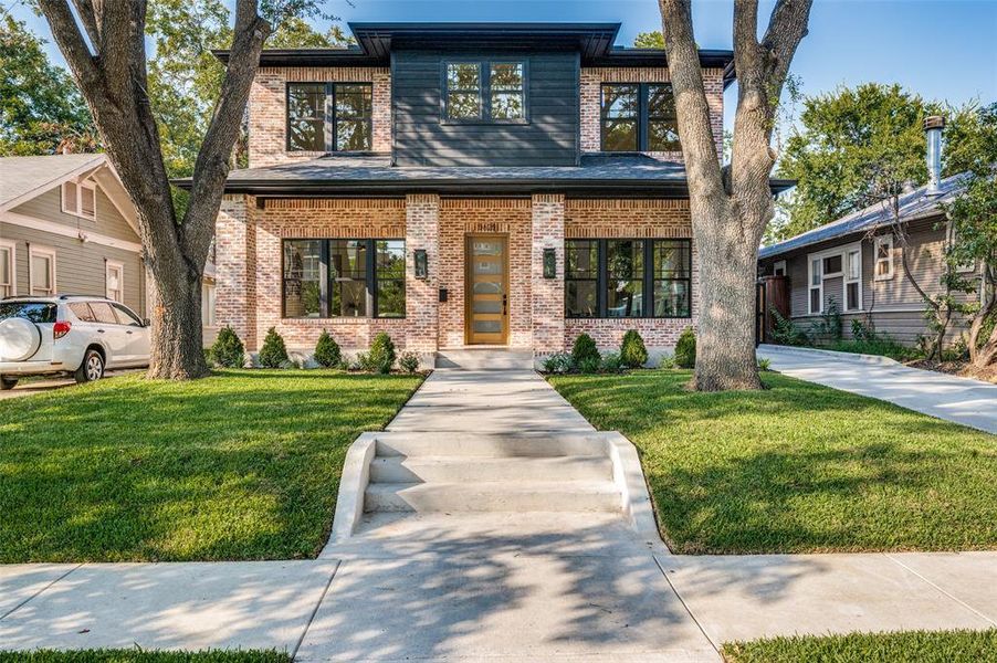 View of front of property with a front lawn