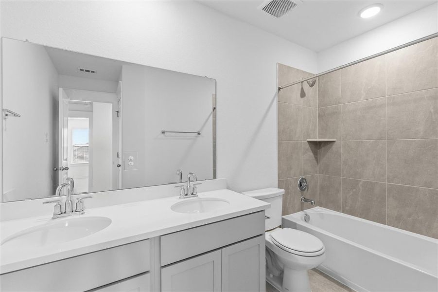 Bathroom with double vanity and shower / bath combination Bathroom with double vanity and shower / bath combination