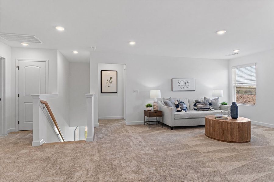 A living room with a couch and a table.