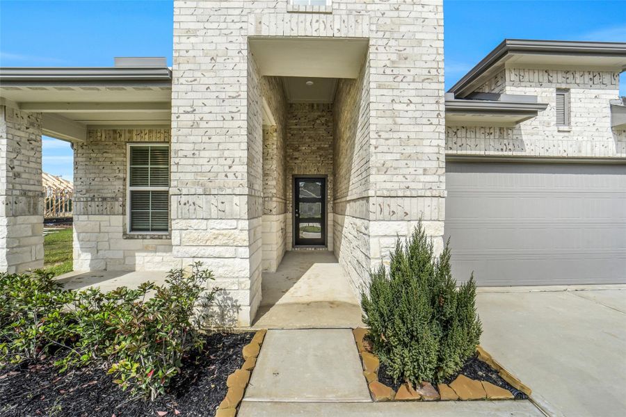 Exterior details and patio area of a home in Windmill Estates, Magnolia (Image 3).