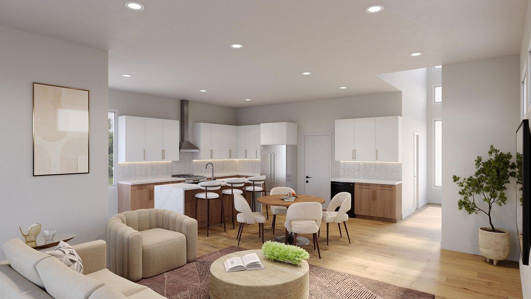 Open-concept living space featuring wood-finish flooring, recessed lighting, and a modern kitchen with a large island