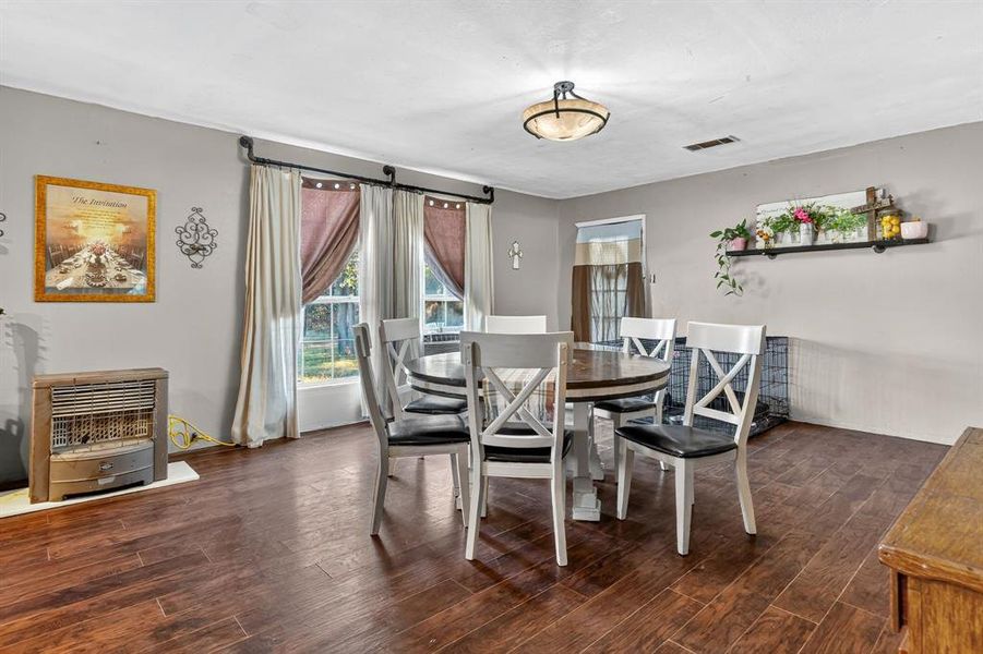 Dining area featuring dark wood-type flooring Dining area featuring dark wood-type flooring